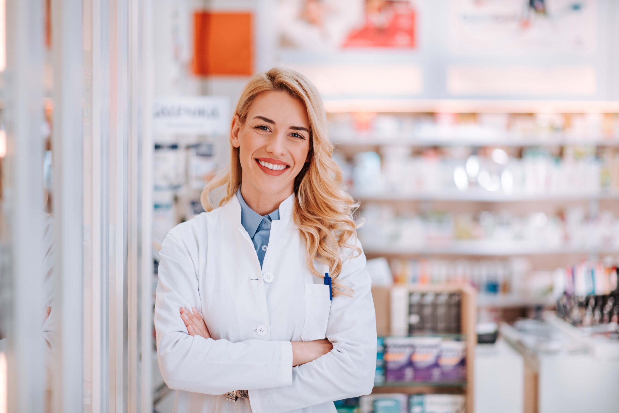 Portrait of a smiling healthcare worker in modern pharmacy